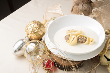 Festive Escudella Soup in Elegant Christmas Setting – Traditional Catalan Holiday Dish with Golden and Natural Décor