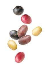 Different types of fresh potatoes falling on white background