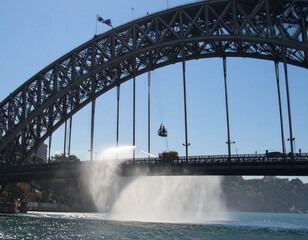 A dramatic water cascade from the iconic Sydney Harbour Bridge during a special event or performance, creating a spectacular splash in the harbour