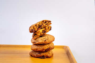 Stack of Dark Chocolate cookies isolated, American biscuits, cocoa confectionery cake, sweet morsels bakery, round pastry on white background