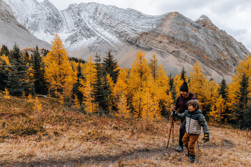 Mother and child hiking in the mountains on a beautiful Autumnal day