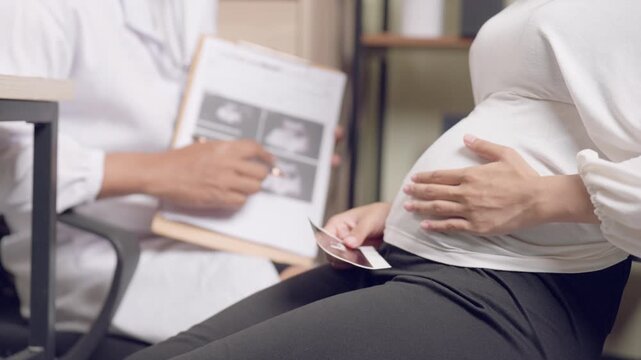 Pregnant woman receiving maternal health support during consultation with medical professional. Emphasizing pregnancy wellness.