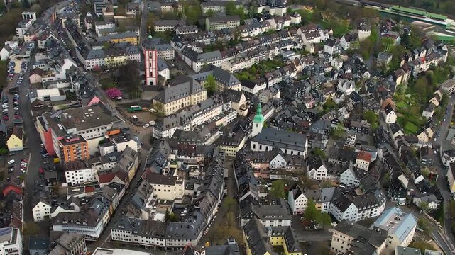Aerial panorama view of the downtown city Siegen in Germany on a cloudy afternoon in late summer