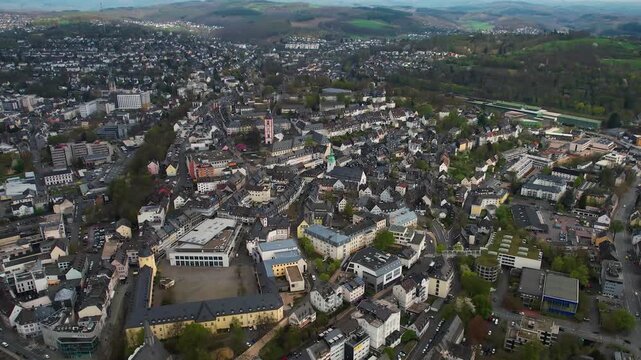 Aerial panorama view of the downtown city Siegen in Germany on a cloudy afternoon in late summer