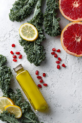 Overhead composition of kale citrus and pomegranate with copy space ideal for cooking blog and health photography