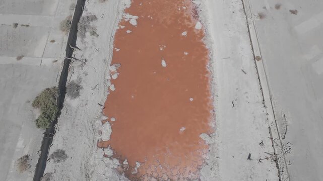 Raw D-Log Aerial Overhead Shot of Contaminated Red Water Canal at Salton Sea California
