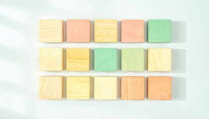 Colored Wooden Blocks: A vibrant collection of precisely arranged, multi-hued wooden blocks invites tactile exploration, perfect for educational use or artistic composition.
