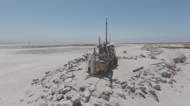 Raw Drone Footage of Abandoned Ship Surrounded by Rocks at Bombay Beach Salton Sea California