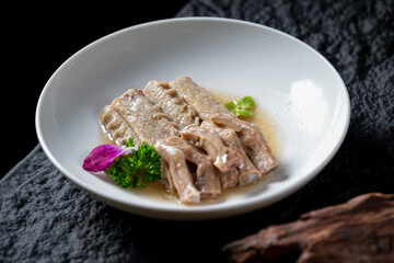 A plate with deliciously cooked duck wings and feet, presented in an appetizing manner.