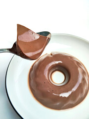 A Spoonful of Silky Chocolate Pudding with a Glossy Finish