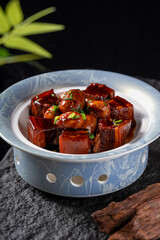 A plate of delicious braised pork cubes with a savory appearance, ready to be enjoyed as a main...