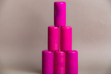 Pink and purple containers stacked on top of each other. Concept of organization and structure, as the containers are arranged in a neat and orderly manner.