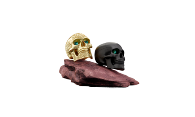 Two ornate skulls, gold and black, resting on a rock, reflective surface, 3D render, digital art, Halloween, death, memento mori, 