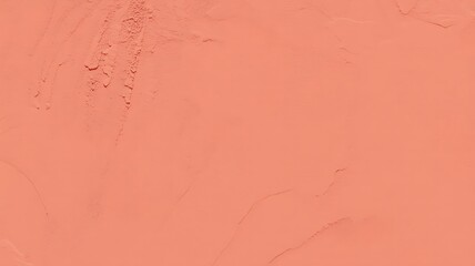 Fototapeta premium A textured abstract background with subtle imperfections and a warm peachy coral hue evoking a sense of vintage charm and organic feel