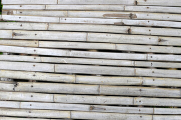 Obraz premium Old rustic bamboo backdrop with natural texture.
