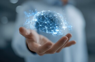 A hand holds a holographic brain.  Connections and neural pathways are visible