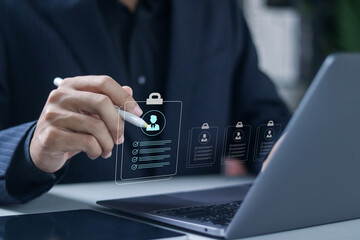 Recruitment concept. We are hiring, Join our team, employment agreement, vacant job position. Recruiter using laptop to look at candidate profiles.