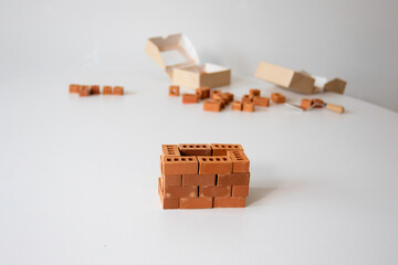Build a miniature tower from bricks. Constructor with small bricks