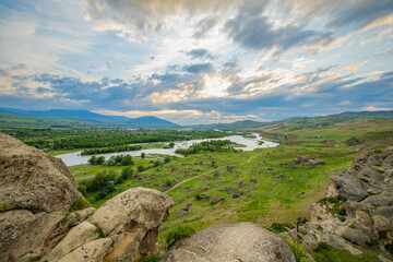 Scenic sunset views looking across the Kura River from the top of the ancient rock town of Uplistsikhe near the city of Gori, Georgia