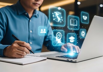 Man using laptop with glowing digital education and business icons