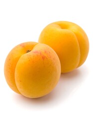 Two ripe apricots on white background