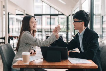 Business negotiation in a casual collaborative office environment with positive dynamics