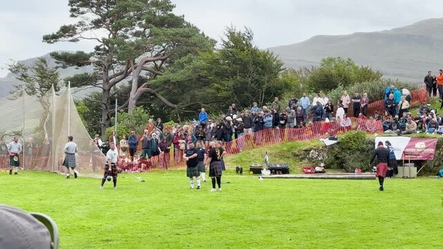 Athletes Practicing Hammer Throw at Highland Games Event