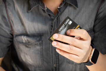 Woman holding several credit cards and he is choosing a credit card to pay and spend Payment for goods via credit card. Finance and banking concept	