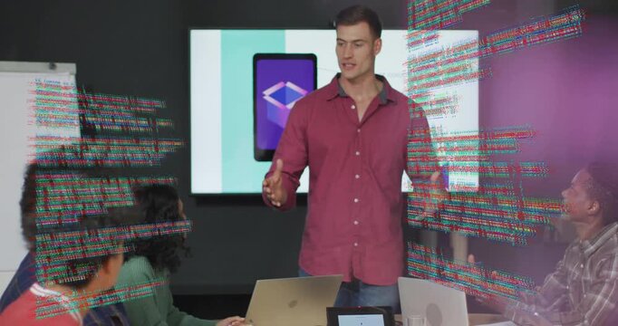 Presenter spreading arms, on tablet slide appearing code swirling around team explaining software