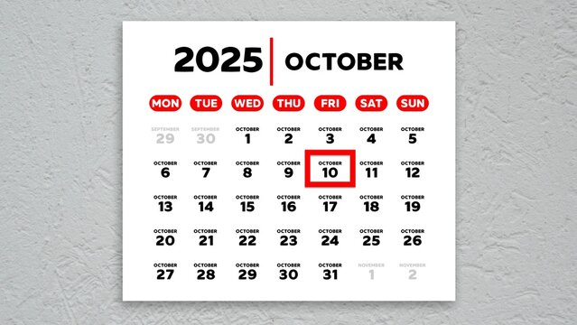 The date October 10th marked with a red cursor on the wall calendar 2025