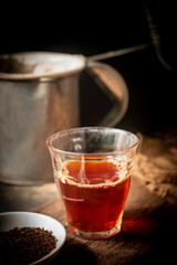 Black coffee on a vintage wooden background