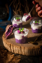 Traditional Thai dessert: mashed purple sweet potatoes topped with coconut milk