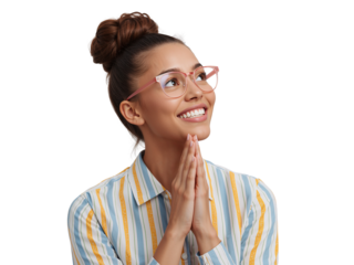 Optimistic young woman with glasses and folded hands expressing hope on isolated background