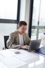 Obraz na płótnie Canvas Business man working using laptop computer Hands typing keyboard. Professional investor working start up project. business planning in office. Technology business