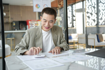Confident asian business man Auditor or internal revenue service staff checking annual financial statements company Audit  Accounting tax