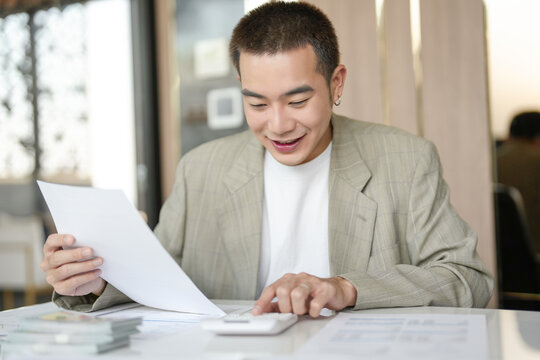 Confident asian business man Auditor or internal revenue service staff checking annual financial statements company Audit  Accounting tax