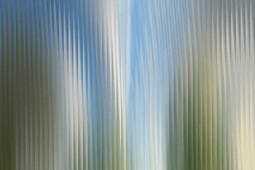 Obraz premium A textured abstract background with vertical lines and a gradient of blue, green, and white colors, creating a sense of depth and movement