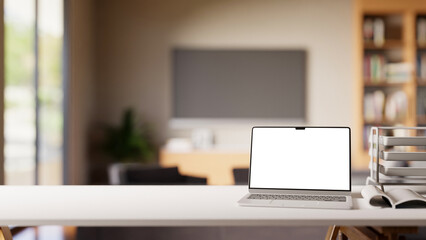 Laptop with blank white screen on office desk in a contemporary home workspace