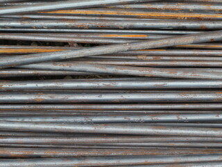 stack of rusty metal rods