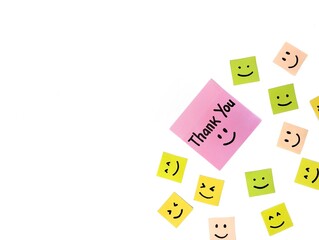 Thank you message on green note paper isolated on white background with smile emoji, Copy space	