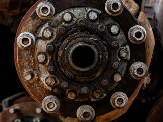 rusty car axles in junkyard