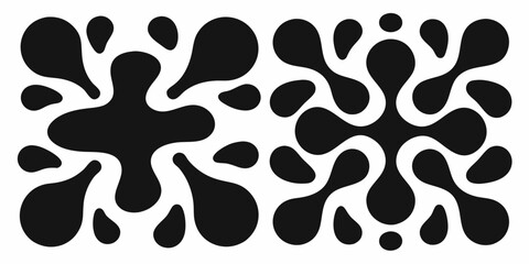 Two Black Organic Blob Shapes on a White Background abstract