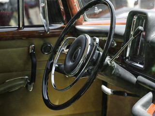 steering wheel detail of a vintage classic car