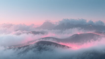 Obraz premium Serene sunrise over misty mountains with soft pink and blue hues