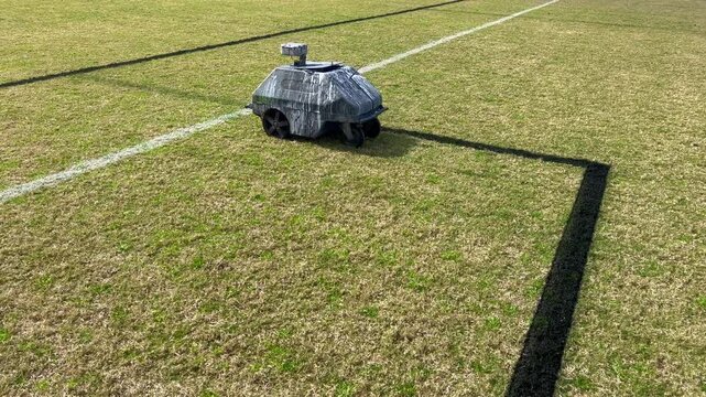 Line marking robot mark lines in soccer field. Robotic line marker use GPS to navigate without human operation the machine or direct location of the lines being laid.
