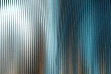 Obraz premium A textured background with vertical ribbed patterns transitioning from a bright, metallic silver to a deep, cool teal blue, creating a sense of depth and modern elegance