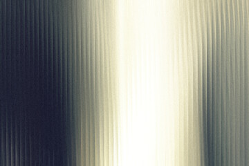 A gradient of light and shadow plays across a textured surface with vertical lines, creating a dramatic and abstract visual effect