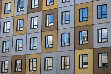 Colourful facade of a residential building in the morning, symbolising the real estate market, rentals, market shifts, demographics, and demand.