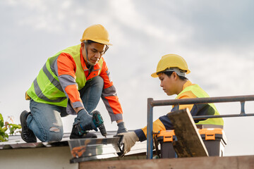 Two Construction Workers Performing Roof Repair with Tools, Safety Gear, Focused Expressions, Clear Sky in Background, Daylight Environment, Construction Site Activity