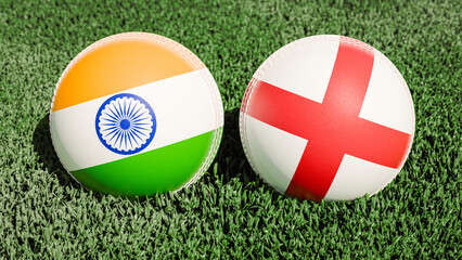 Two cricket balls featuring the flags of India and England, on a grassy field